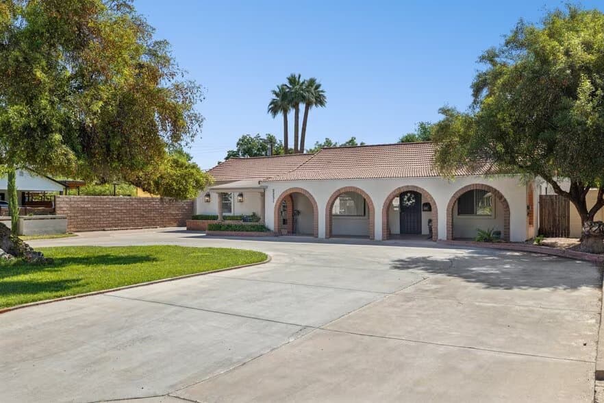 Single-story assisted living home with an arched front porch, E Oak St, Phoenix